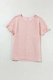 Blush pink textured top with short ruffle sleeves and a crew neck.