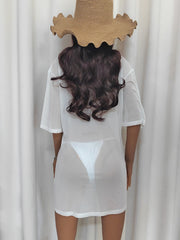 White sheer mesh boatneck oversized top with short sleeves, styled with a straw hat.