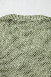 Matcha green open-knit slouchy V-neck sweater with ribbed neckline detail.