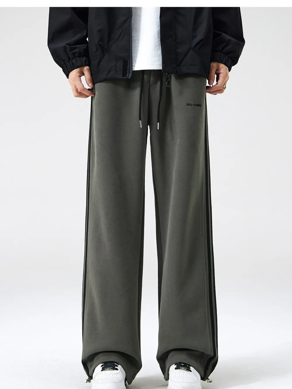 Men's army green sweatpants with black side stripes and drawstring waist.