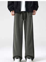 Men's army green sweatpants with black side stripes and drawstring waist.