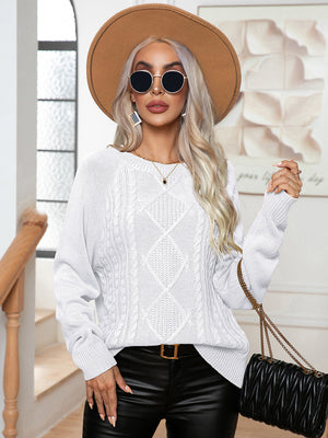 White cable knit raglan sleeve pullover sweater with diamond pattern and crew neck.