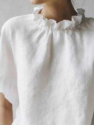 White half-sleeve shirt with ruffled neckline detail