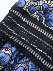 Blue floral lace midi dress with V-neck and crochet trim detail.