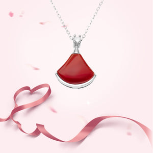 Elegant fan-shaped red agate pendant necklace with sterling silver chain and diamond accent.