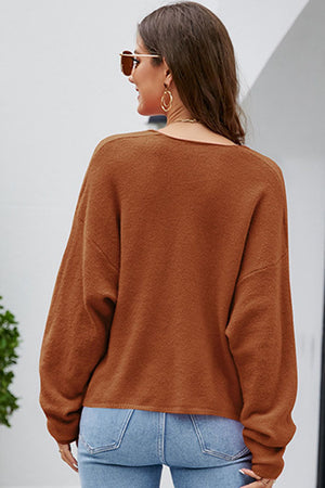 Brown textured knit pullover sweater with long sleeves and a deep V-neck.