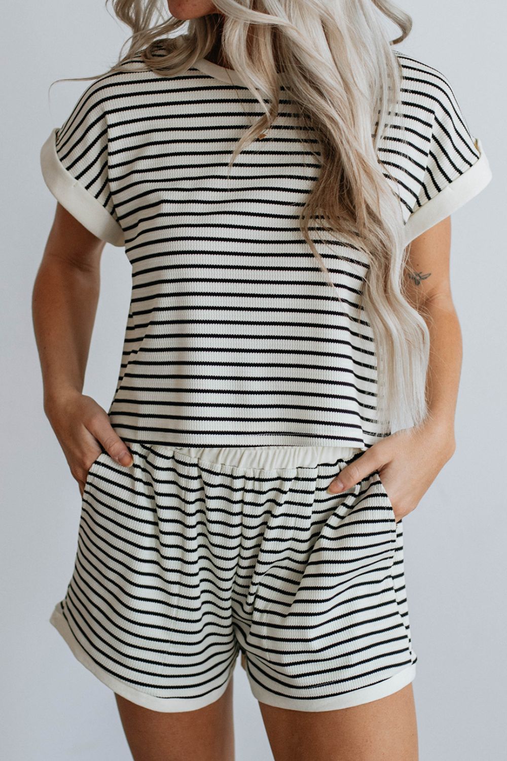 Ribbed stripe tee and short set with cuffed sleeves and elastic waist shorts.