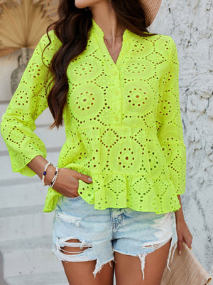 Neon yellow eyelet embroidered peplum blouse with ruffles and buttoned neckline.