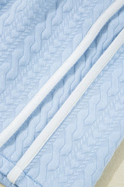 Light blue loungewear set with cable knit texture and white trim detail.