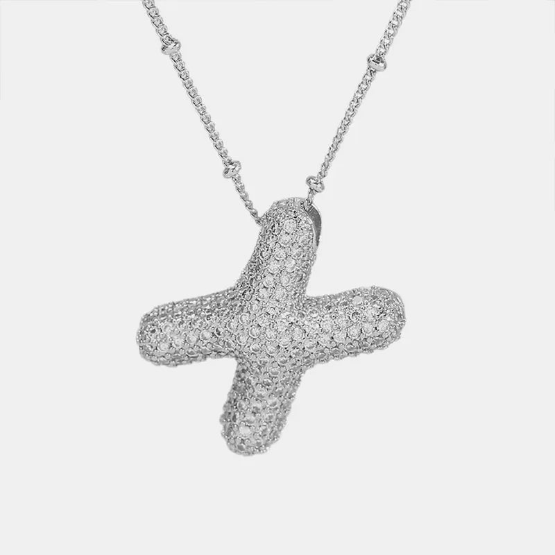 Pave initial pendant necklace with beaded chain, featuring a silver-tone alphabet pendant covered in sparkling stones.