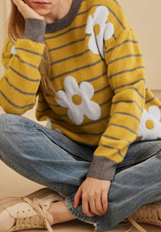 Yellow knit sweater with grey stripes and white daisy intarsia pattern, crew neck, long sleeves.