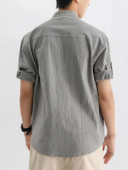Men's gray relaxed fit button-up shirt with rolled short sleeves and a pocket detail.