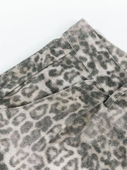 Leopard print cargo pants with utility pockets and button fly.