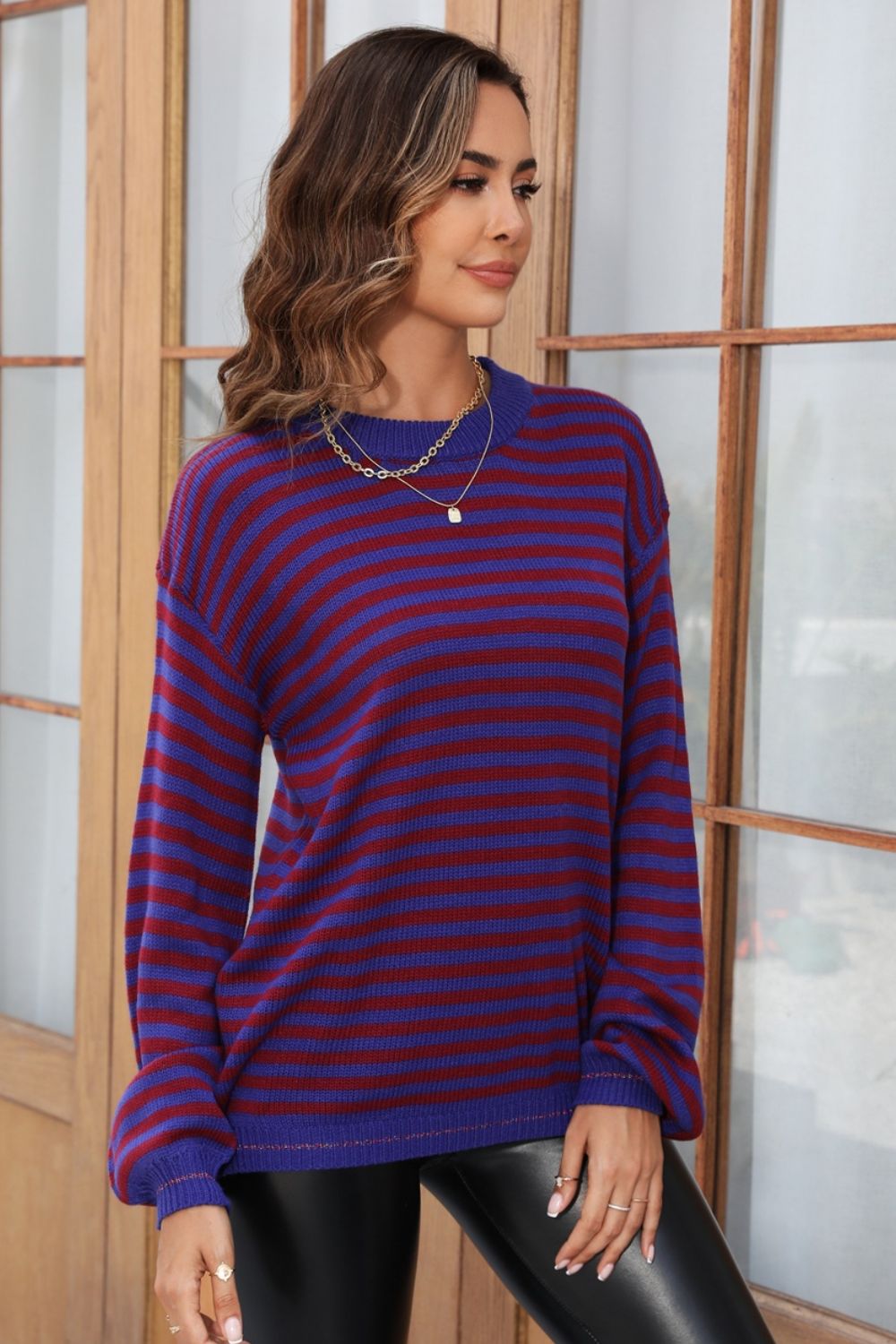 Classic Breton stripe knit crewneck sweater in dark blue and burgundy acrylic.