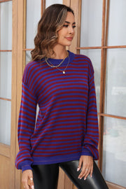 Classic Breton stripe knit crewneck sweater in dark blue and burgundy acrylic.