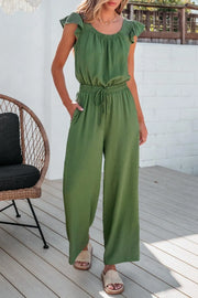 Matcha green textured drawstring palazzo jumpsuit with ruffle sleeves.