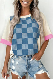 Maternity T-shirt with blue checkered denim front, cream sleeves, and pink cuffs.