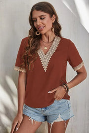 Brown V-neck blouse with lace trim on neckline and sleeves