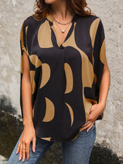 Black abstract print batwing blouse with V-neck and split sleeves