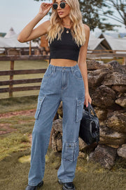 Light wash denim cargo pants with relaxed wide leg and utility pockets.