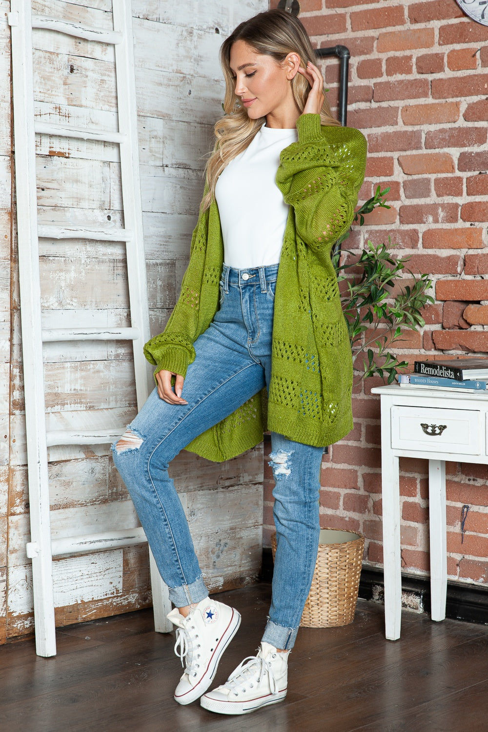 Open-knit slouchy cardigan in matcha green with balloon sleeves and open front.