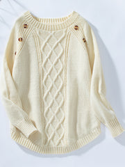 Cream cable knit sweater with button shoulder detail and crew neck.