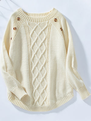 Cream cable knit sweater with button shoulder detail and crew neck.