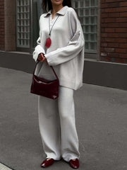Grey knit polo sweater with button detail and wide-leg pants set.
