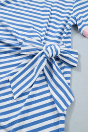 Blue and white striped cotton mini dress with a tie detail at the waist.