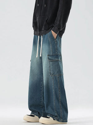 Oversized light blue denim cargo jeans with drawstring waist and utility pockets.