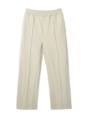 Beige lounge trousers with seam detail and elastic waistband.