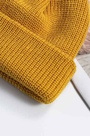 Yellow ribbed knit beanie with a turn-up cuff