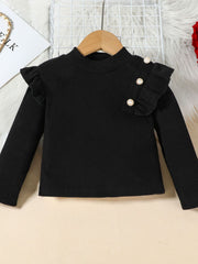 Black ribbed long sleeve top with ruffled shoulder detail and decorative pearl buttons.