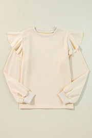 Cream ruffled shoulder sweatshirt with ribbed cuffs and crew neck.