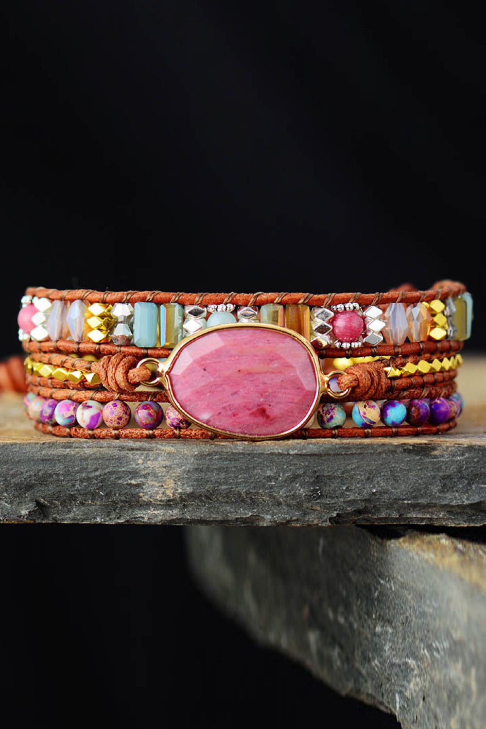 Bohemian wrap bracelet with pink stone and colorful beads on leather cords