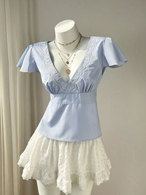 Blue pinstripe polyester blouse with lace V-neck and flutter sleeves.