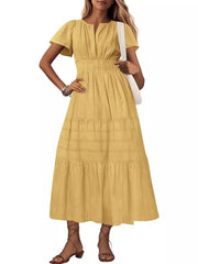 Yellow tiered midi dress with V-neck, flutter sleeves, and smocked waist.