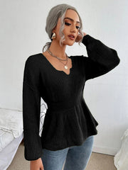 Black peplum knit sweater with scallop neckline and long sleeves