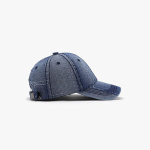 Denim patchwork baseball cap in light blue with adjustable strap and metal buckle detail.