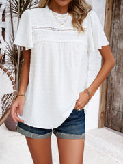 White dotted swiss smocked bodice blouse with flutter sleeves and lace trim detail