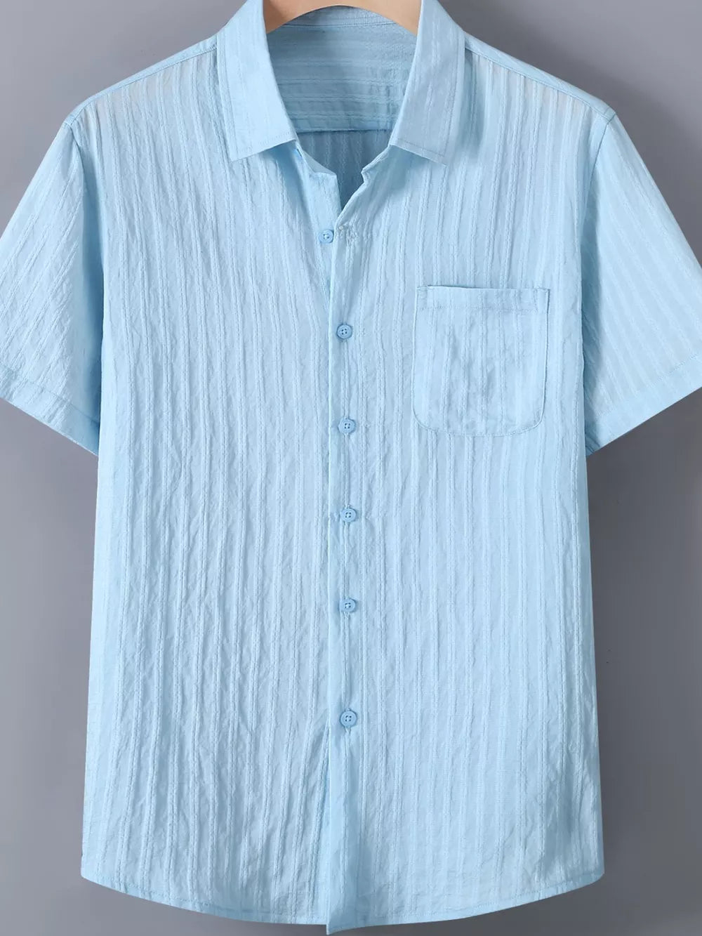 Light blue textured button-up short-sleeve men's shirt with chest pocket.