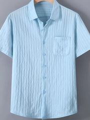 Light blue textured button-up short-sleeve men's shirt with chest pocket.