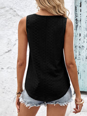 Black eyelet tank top with a textured pattern and curved hem.