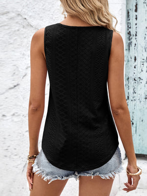 Black eyelet tank top with a textured pattern and curved hem.