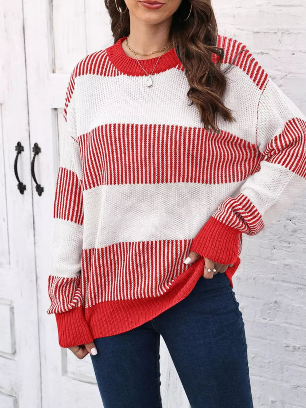 Cozy knit sweater with color block stripes in red and white, crew neck, long sleeves.