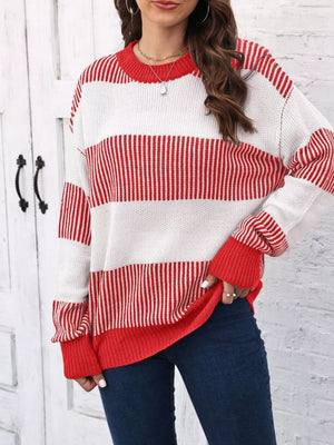 Cozy knit sweater with color block stripes in red and white, crew neck, long sleeves.