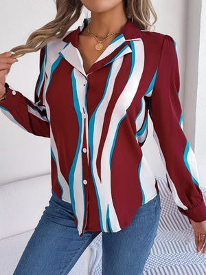 Burgundy wavy stripe collared blouse with button front and long sleeves.