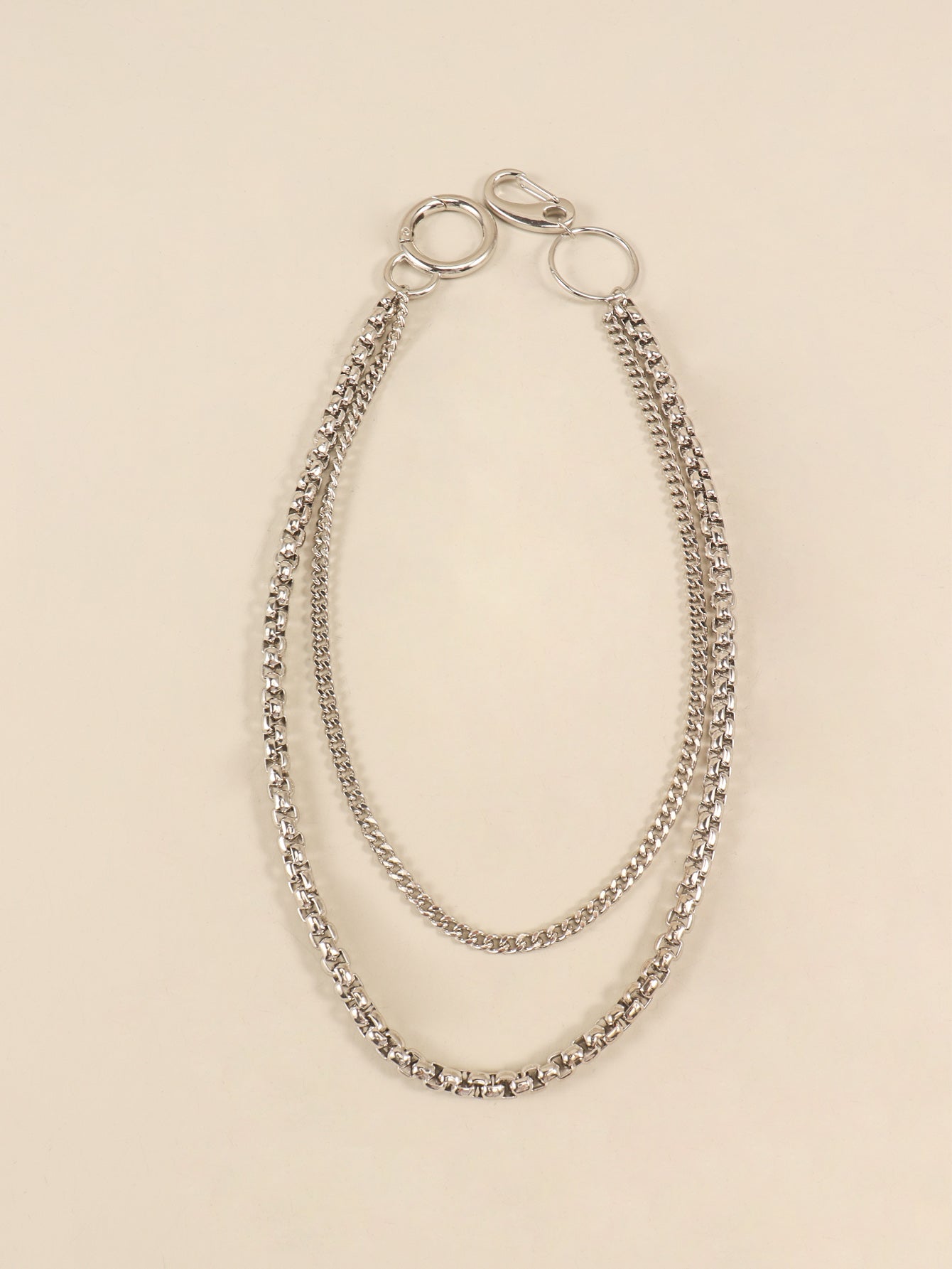 Silver double-strand chain pant accessory with lobster clasp and carabiner clip.