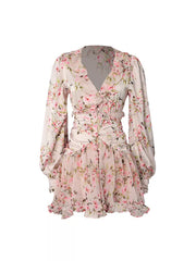 Charming ruffled floral mini dress with V-neck, button front, and long puff sleeves.