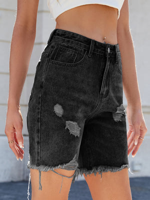 Black distressed denim bermuda shorts with frayed hem and ripped details.